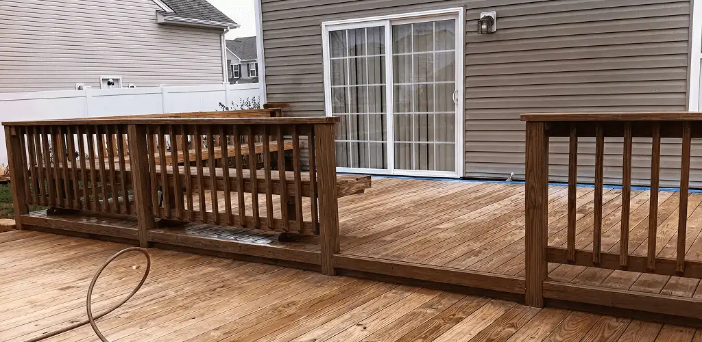 Deck sealing service protecting a backyard wood deck and railings in Little Rock, AR