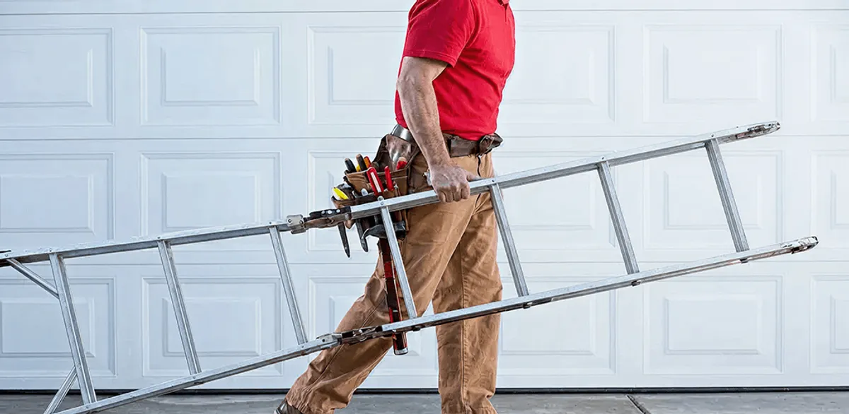 Garage door repair technician arriving with tools and ladder in Little Rock, AR
