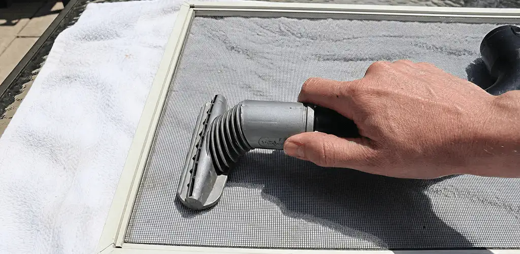 Window screen repair cleaning and fixing a damaged screen mesh in Little Rock, AR